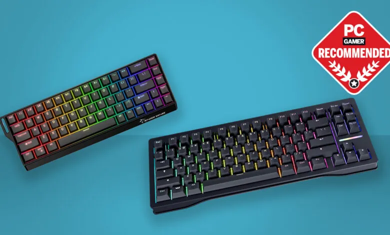 Two RGB gaming keyboards, one compact and one full-size, shown against a teal background. PC Gamer Recommended logo is visible.