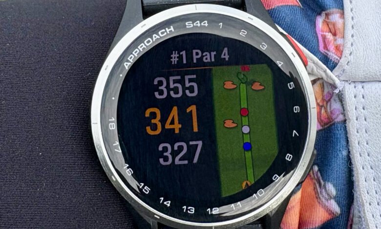 Golf smartwatch displaying distances to the green on hole #1, a par 4, showing 355, 341, and 327 yards.
