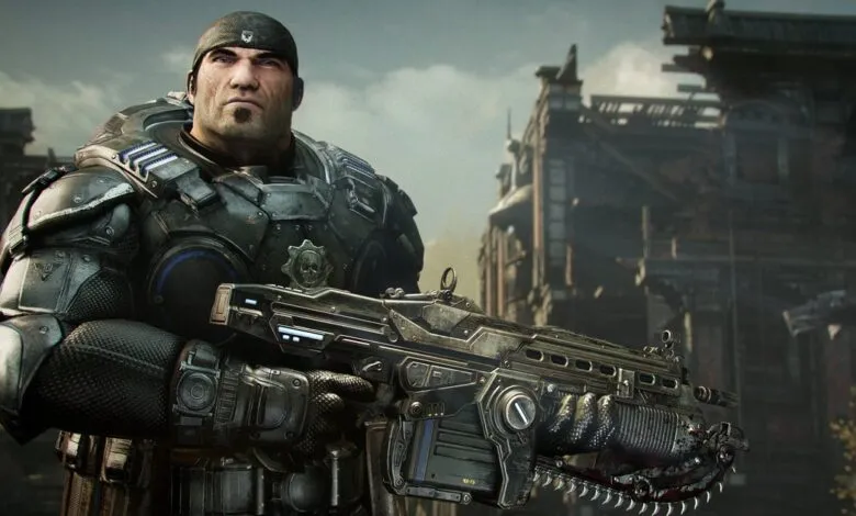Gears of War character Marcus Fenix wielding a Lancer assault rifle in a war-torn city.