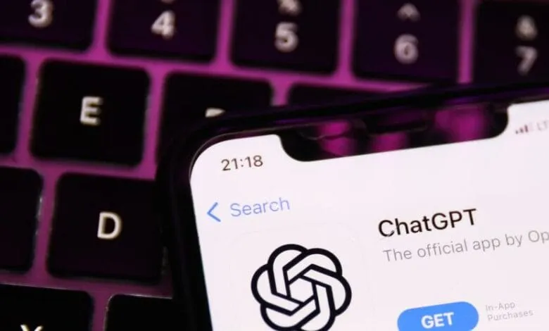 Close-up of a smartphone displaying the ChatGPT app on its screen, resting on a purple keyboard.