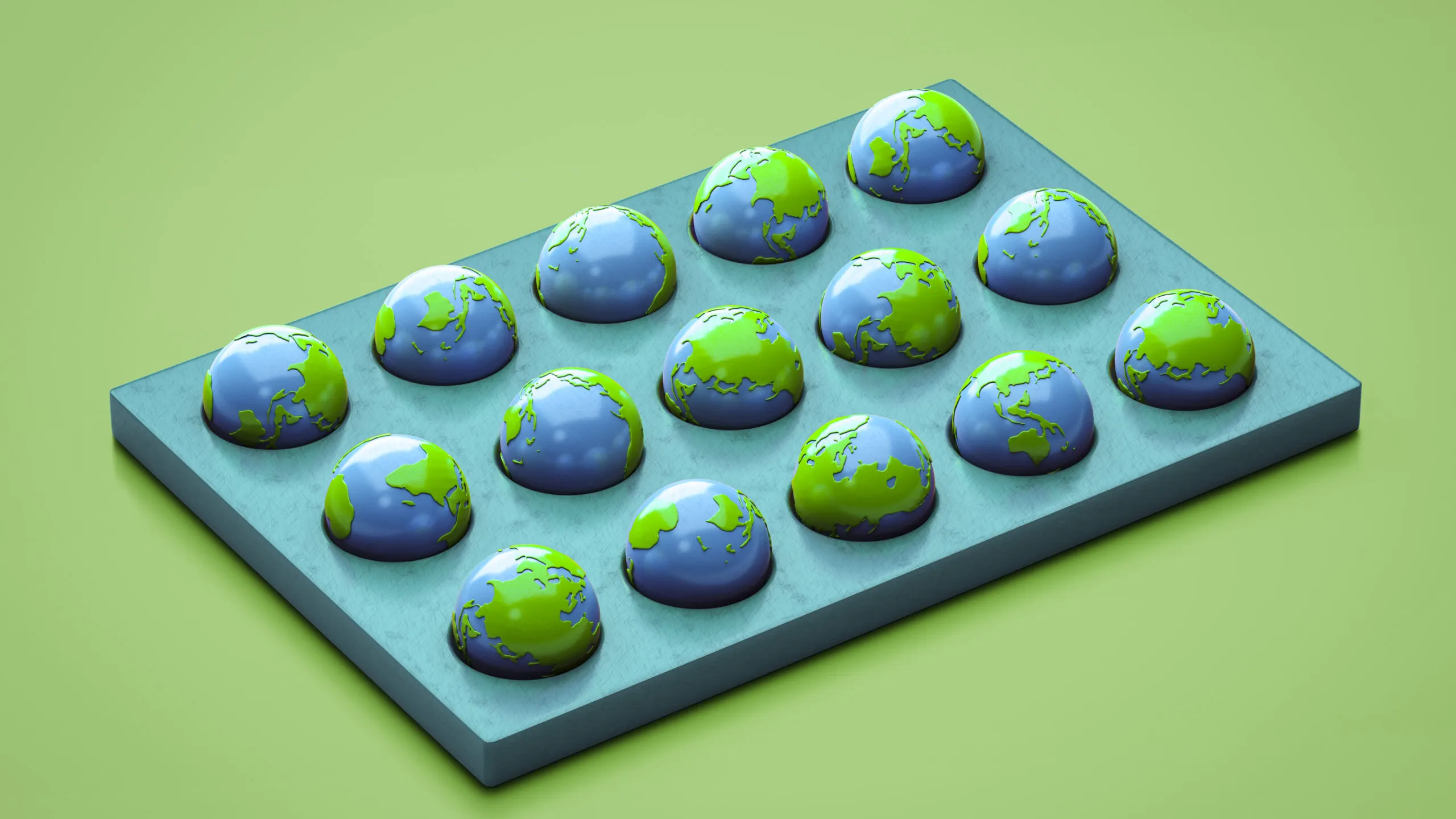 Miniature globes arranged in a grid on a teal tray against a green background.