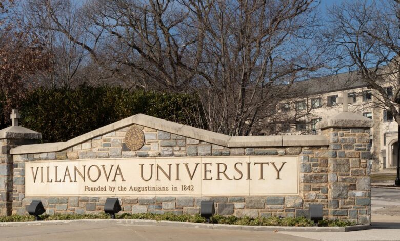 Villanova University entrance sign, stone wall with university name and founding date.