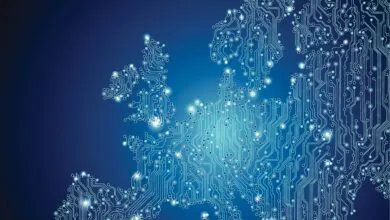 Europe map formed by circuit board design, glowing blue and teal, representing digital technology in Europe.