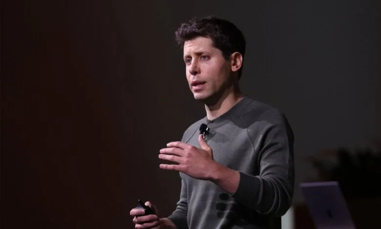 Travis Kalanick, former CEO of Uber, speaks at a conference, gesturing with his hands.