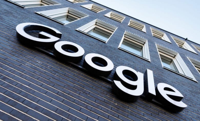 Close-up of the Google logo on a dark brick building in Munich, Germany.