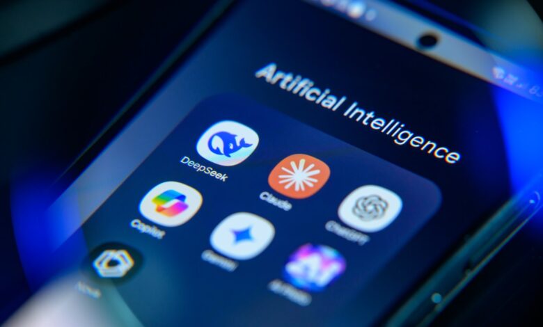 Smartphone screen displaying AI apps: DeepSeek, Claude, and others. Cool blue tones.