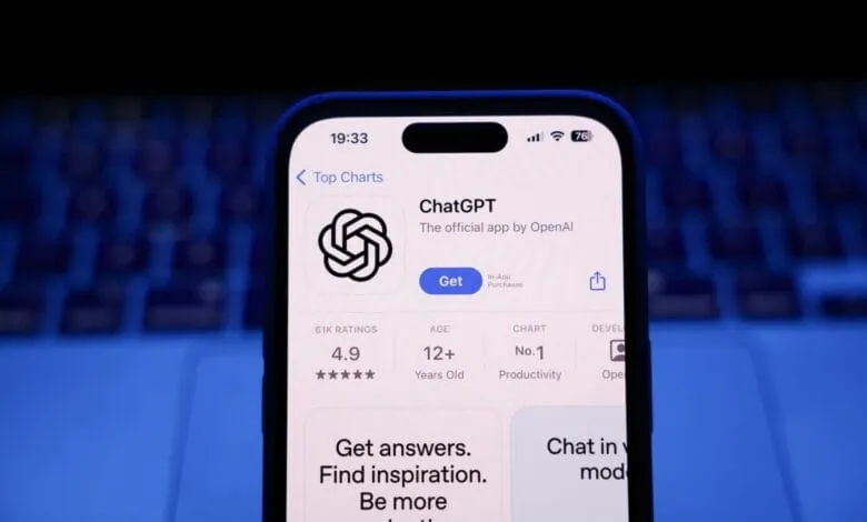 Close-up of an iPhone displaying the ChatGPT app on the App Store, showing its high rating and top chart position.