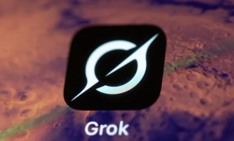 Grok app icon on a smartphone screen. The icon is white on black, with a stylized 'G'.