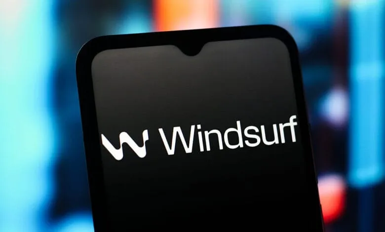 Close-up of a smartphone displaying the Windsurf logo on a dark screen.