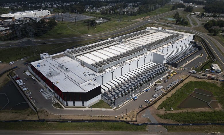Aerial view of a large data center in Ashburn, Virginia, surrounded by residential areas.