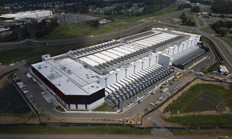 Aerial view of a large data center in Ashburn, Virginia, surrounded by residential areas.