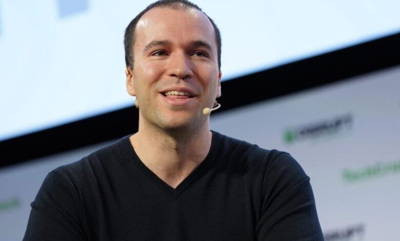 Greg Brockman, OpenAI president, smiles while speaking at an event.