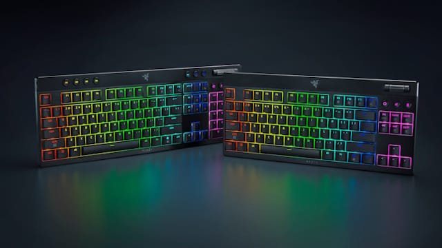 Two Razer gaming keyboards with vibrant RGB backlighting, displayed on a dark surface.