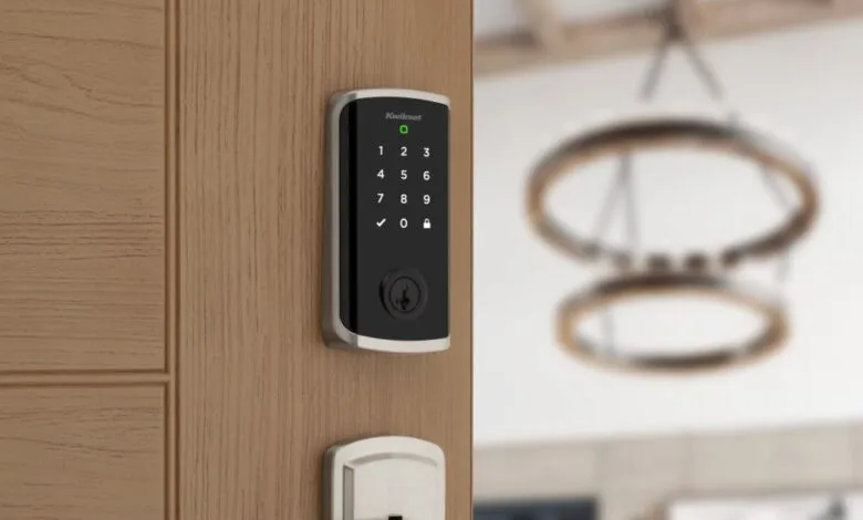 Kwikset Halo Touchscreen Smart Lock on a light wood door.