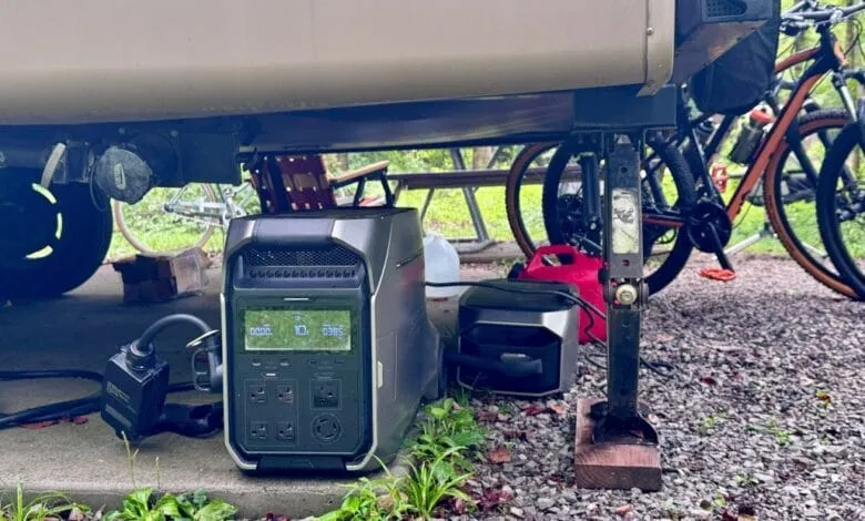 Portable power stations under an RV, near bikes. Perfect for off-grid camping.