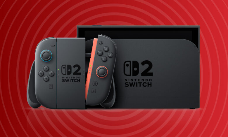 Nintendo Switch OLED model with a dark gray console and coral joy-cons in its box.