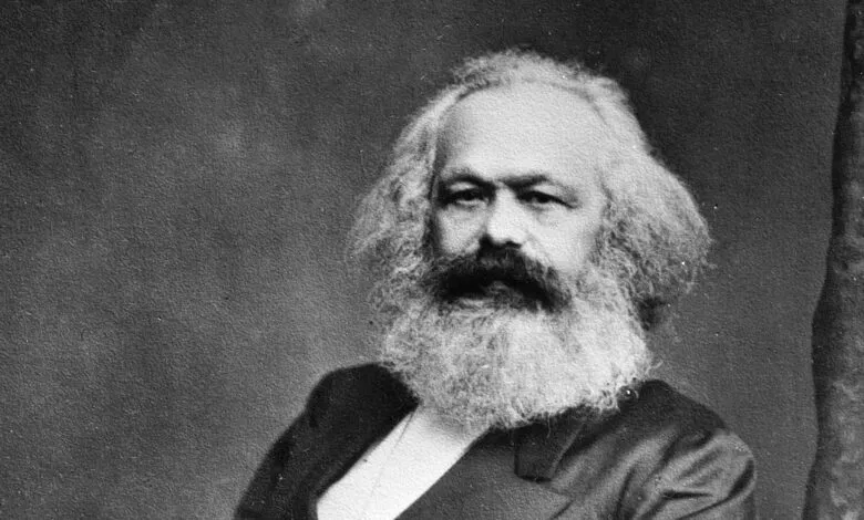 Black and white portrait of Karl Marx, a prominent philosopher and economist.