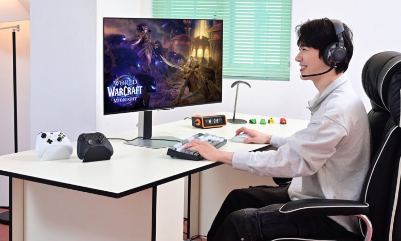 Young man plays World of Warcraft: Midnight on PC, wearing headset. Modern gaming setup with Xbox controllers.