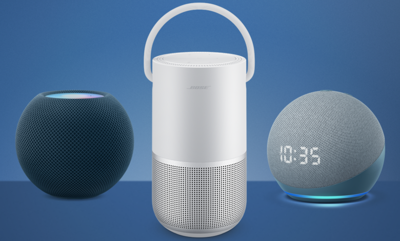 Three smart home speakers: Apple HomePod mini (dark blue), Bose Portable Smart Speaker (white), and Amazon Echo Dot (light blue) on a blue background.