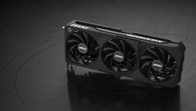 MSI GeForce RTX graphics card with three fans, black and sleek design, on a dark surface.