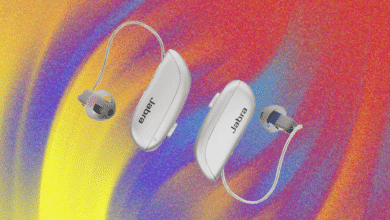 Two sleek, silver hearing aids, one labeled 'euger' and the other 'Jabra', are shown against a vibrant, multicolored background.