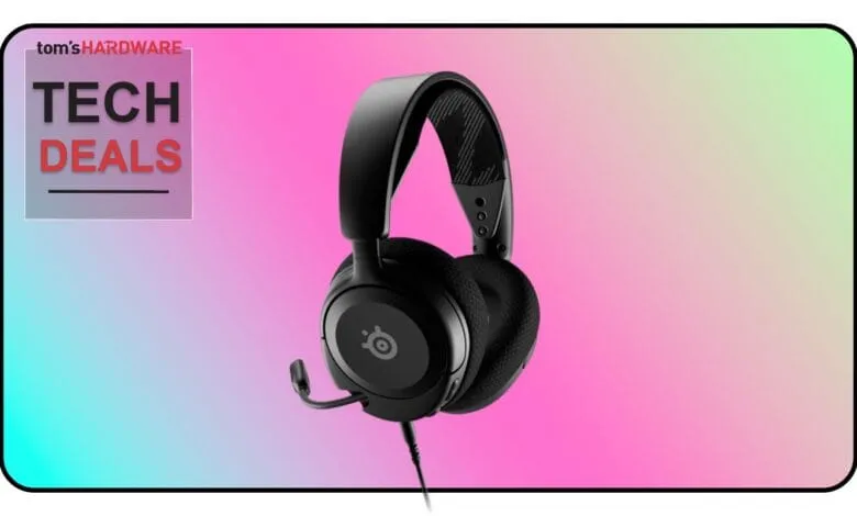 Black wired gaming headset with microphone against a pink and teal gradient background. Tech Deals promotion.