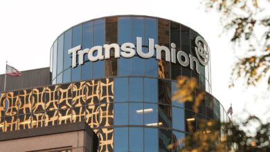TransUnion headquarters building exterior shot, showcasing the company logo prominently displayed on a modern glass facade.