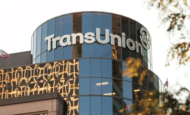 TransUnion headquarters building exterior shot, showcasing the company logo prominently displayed on a modern glass facade.