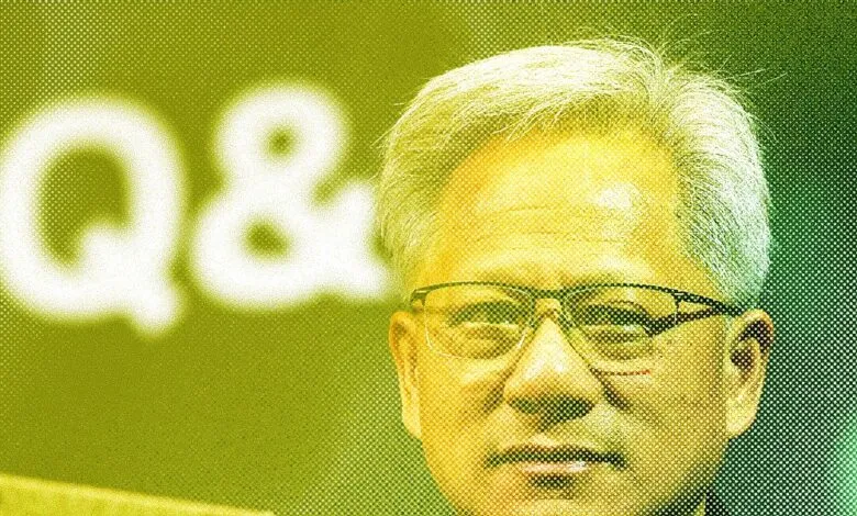 Close-up portrait of a man with glasses, a serious expression, and graying hair. A blurry 'Q&A' is in the background.