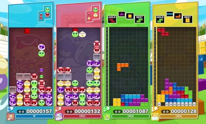 Four-player screen of Puyo Puyo Tetris 2, showing colorful blocks and cute characters in simultaneous gameplay.