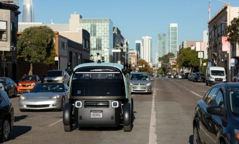 Self-driving Zoox vehicle navigating a San Francisco street.