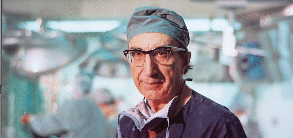 Portrait of Michael E. DeBakey, renowned cardiovascular surgeon, in a surgical setting.