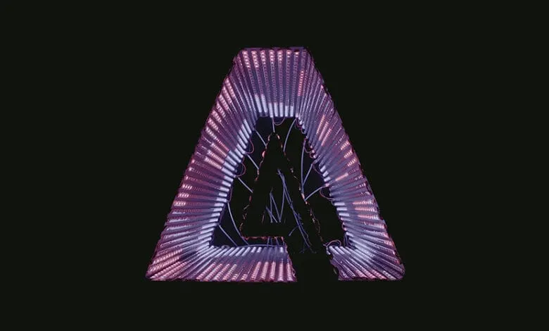 Silhouette of a person inside a glowing triangular light sculpture resembling the Adobe logo.