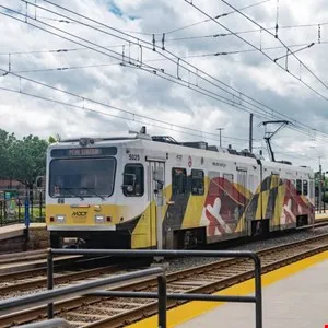 Maryland Transit Administration (MTA) light rail train at a station.