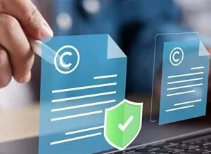Person digitally signing documents with copyright symbols and a security shield, signifying secure digital document signing.