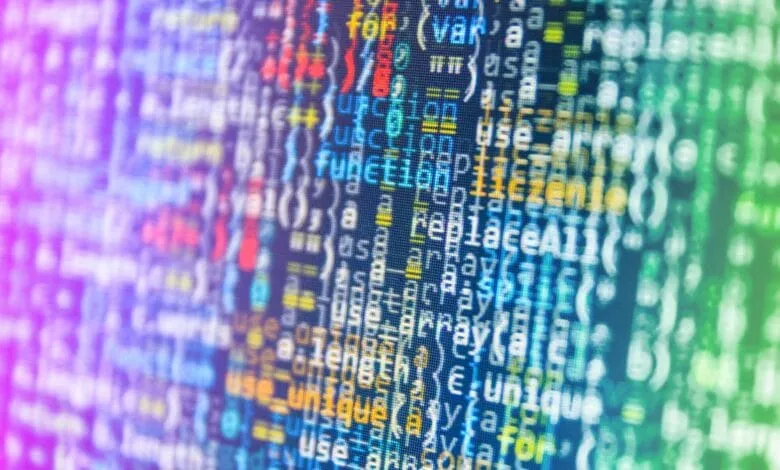 Abstract close-up of colorful computer code on a screen, showcasing lines of programming text.