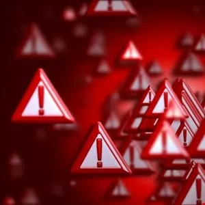 Many red triangular warning signs with exclamation points float in a red background.