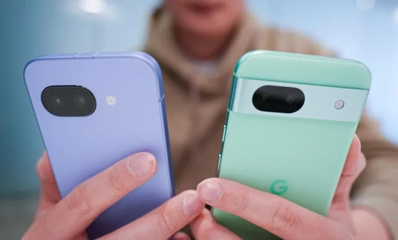 Close-up of two smartphones, one lavender and one mint green, held side-by-side.