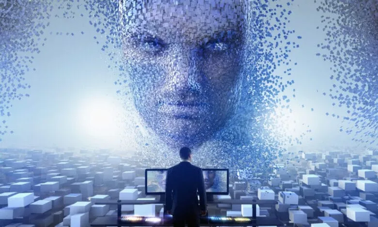 A businessman stands before two computer screens displaying a digital face dissolving into blue cubes, symbolizing AI.