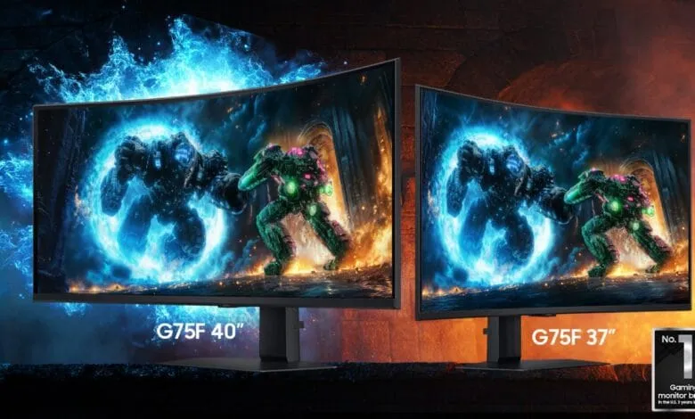 Two curved gaming monitors, a 40" and a 37", display a vibrant action scene with mechs battling amidst fiery energy.
