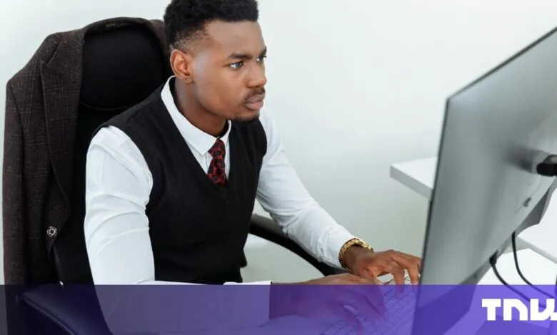 Focused businessman working on computer