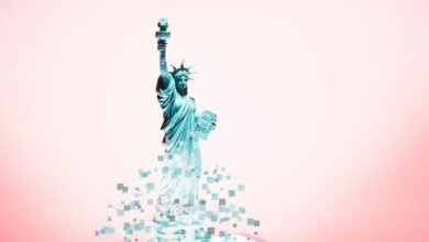 Statue of Liberty digitally dissolving into pixels against a pink background.