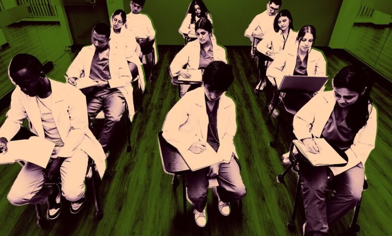 Diverse group of medical students in white coats taking notes in a classroom.