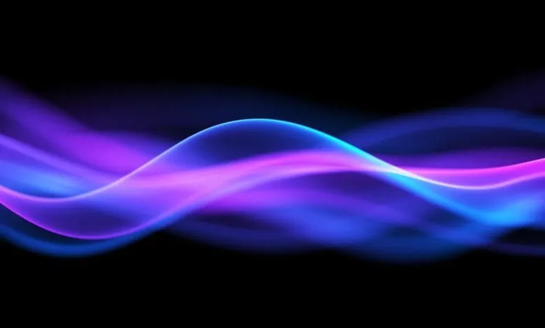 Flowing waves of electric blue and purple light against a dark background.
