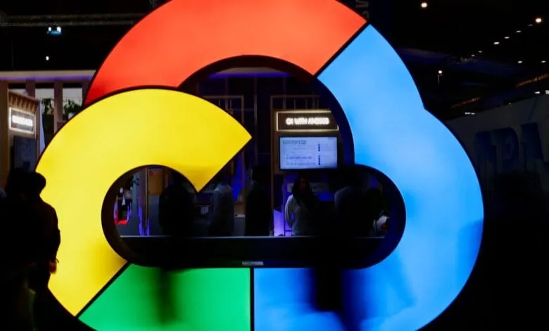 Large illuminated Google Cloud logo at a tech event, vibrant colors against a dark background.