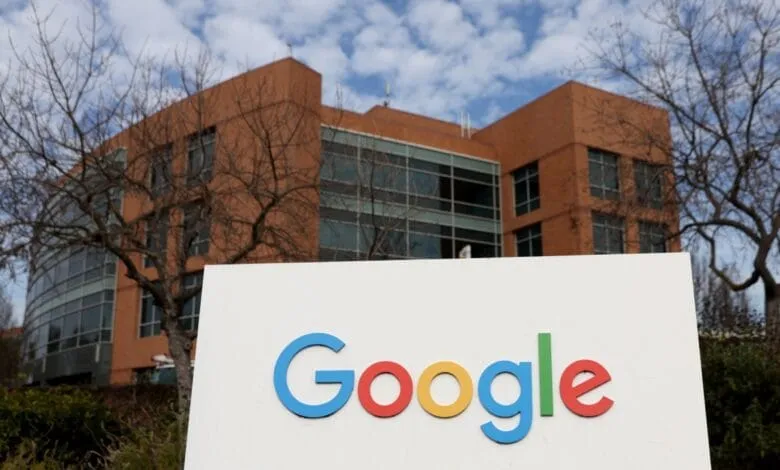 Google logo on a white sign in front of a Google building.