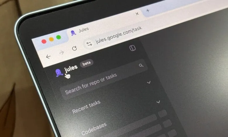 Close-up of a laptop screen showing the Jules task management interface on Google. A purple octopus icon is visible.