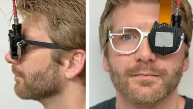 Man wearing prototype holographic glasses, side and front views. Black and white device attached to eyewear.