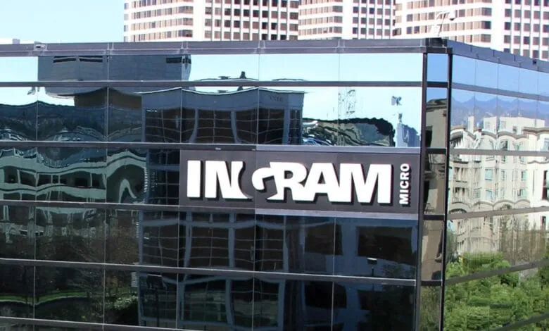 Ingram Micro headquarters building reflected in its glass facade, showcasing the company logo.