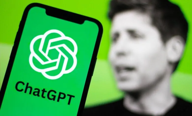 ChatGPT app on a smartphone with Sam Altman, OpenAI CEO, blurred in the background.